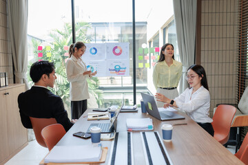 Modern office meeting room with professionals finalizing an agreement.