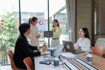Modern office meeting room with professionals finalizing an agreement.