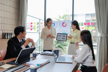 Modern office meeting room with professionals finalizing an agreement.