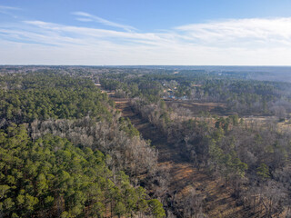 Aerial landscape suburban residence forest winter after Hurricane Helene Evans Augusta Georgia