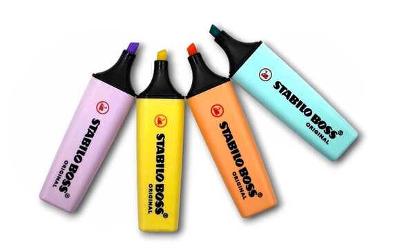 Top view of a set of four stabilo original markers, isolated on white background.