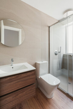 Compact modern bathroom with wood and stone elements