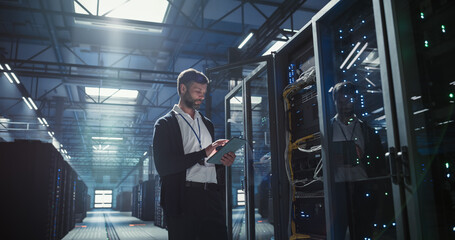 Technician works in data center.