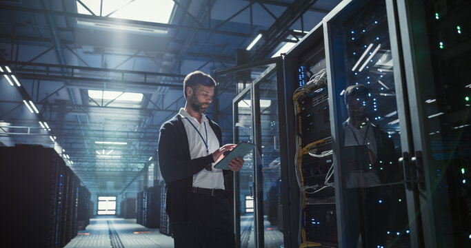 Technician works in data center.
