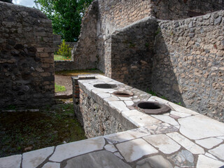 a thermopolium in Pompeii, an ancient Roman city buried by the eruption of Mount Vesuvius in 79 AD