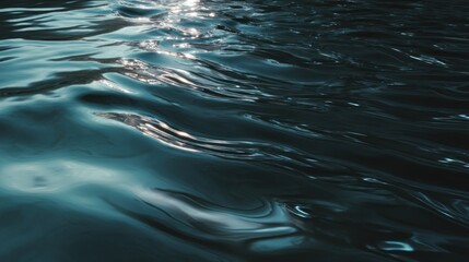 Mesmerizing ripples of a dark blue body of water catching sunlight reflection
