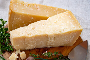Traditional italian food, 36 months aged in caves Italian parmesan hard cheese from Parmigiano-Reggiano and grana padano from Po river valley, Italy