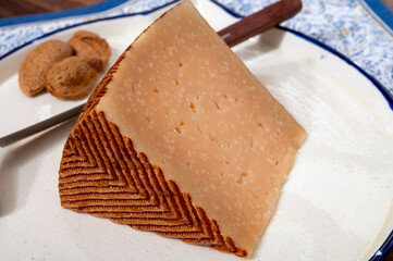 Very old anejo tostado Spanish hard cheese, cow and sheep curado, manchego, goat cheese close up