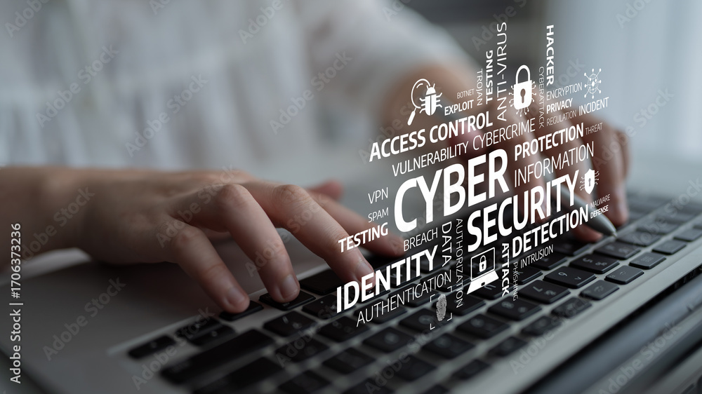 Poster this image showcases a laptop keyboard with cybersecurity terms overlaying, highlighting the importa