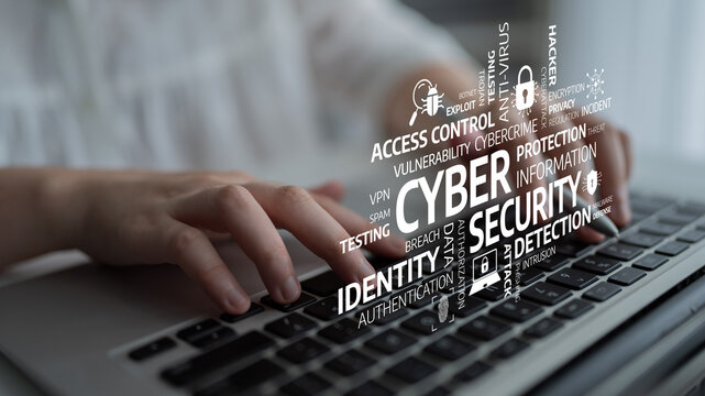 This image showcases a laptop keyboard with cybersecurity terms overlaying, highlighting the importance of protection and identity in the digital world. Tessel