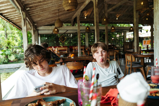 Two Friends Enjoying a Casual Meal in Nature