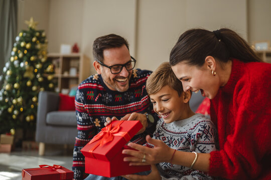 Family enjoying christmas morning gift exchange
