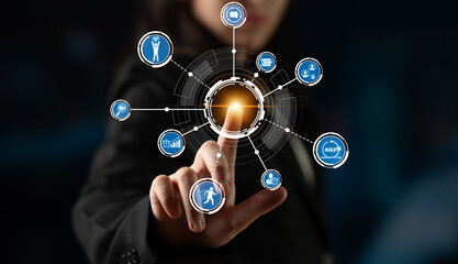 Fototapeta premium A business professional engaged in a futuristic digital interface, visualizing data and technology. The image conveys innovation and connection in a modern corporate setting. Crux