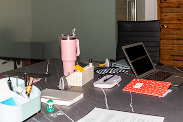 Flash-lit image showing a disorganized workspace surface