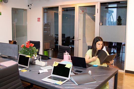 General shot of an office employee working on a marketing project
