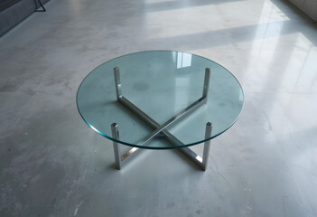 Round Glass Coffee Table with X‑Shaped Metal Base  
Minimalist Design on Light Concrete Floor  
