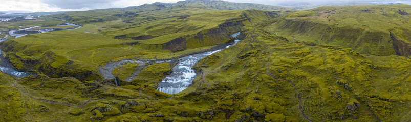 Aerial View of Icelandic Waterfall in Moss Covered Canyon