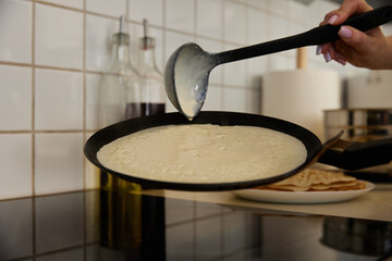 Frying pan with flying pancake