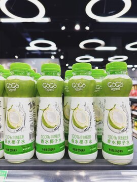 29.05.2025, Kuala Lumpur, Malaysia. Green and white Coco Royal bottles of coconut water arranged on supermarket shelves. Plastic packaging with tropical design.
Coconut water, natural hydration.