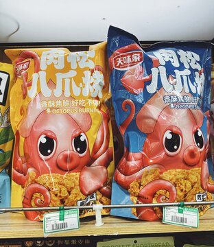 29.05.2025, Kuala Lumpur, Malaysia. Large colorful bags of octopus-flavored snacks with cartoon octopus illustrations displayed on store shelves. Seafood snacks, fun packaging.