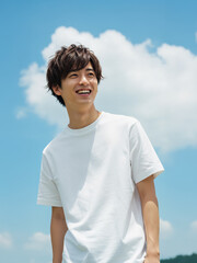 Asian young male mockup model wearing white plain T-shirt on a sunny day, outdoor fashion template