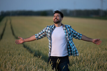 Farmer letting go of all worries on evening walk through fields