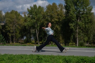Caucasian woman roller skating in park. 