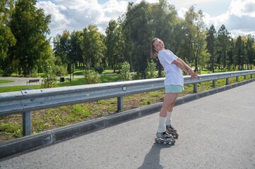 Caucasian woman in shorts roller skating. 