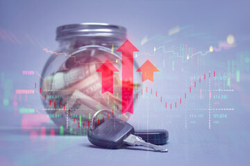 Transparent glass jar filled with money and car keys overlaid with red upward arrows and stock market charts. The concept represents savings growth, financial investment success.