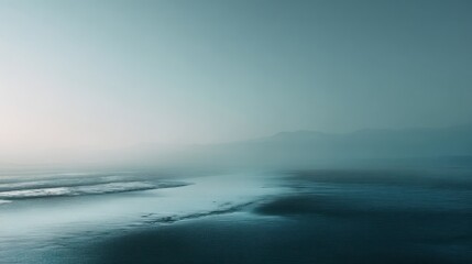 Fototapeta premium Mystic shoreline at dusk with ethereal fog rolling over the moody coastal scenery