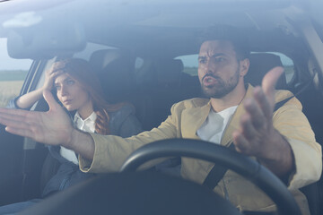 Couple stressed and angry at traffic on road