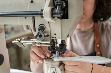 Woman tanner at work in the workshop. 
