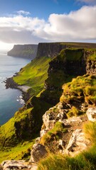 Dramatic coastal cliffs meet a vibrant green valley