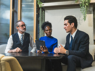 business meeting discussion among people seat around table modern office tablet on table convey collaboration communication relax working environment making suitable content related team office life.