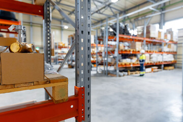 Obraz na płótnie Canvas Blurred background Warehouse industrial premises for storing materials of factory. Concept logistics, transport, Motion blur effect
