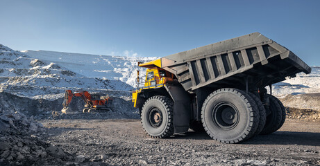 Banner coal mining, heavy machinery work in open pit gold ore mine
