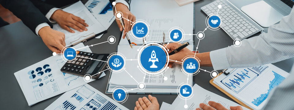 A dynamic scene depicting a business meeting where team members collaborate on strategies while analyzing data with innovative tools and infographics in a modern office setting. Amity