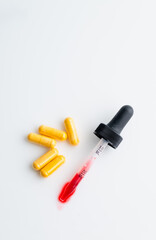 Close up of Vitamin B complex in Pill and Liquid Forms