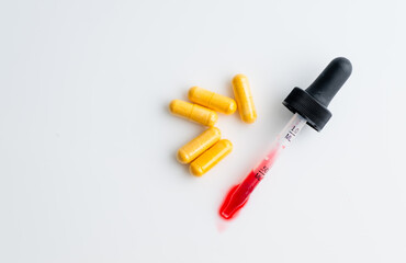 Close up of Vitamin B complex in Pill and Liquid Forms