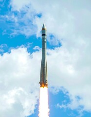 Rocket launch into a partly cloudy sky