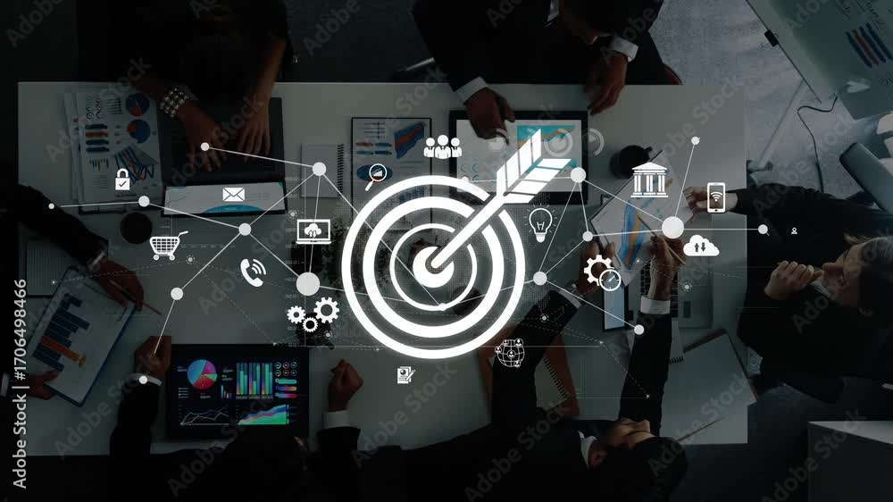 Poster a top-down view of a business team engaged in collaboration with digital graphics representing targe