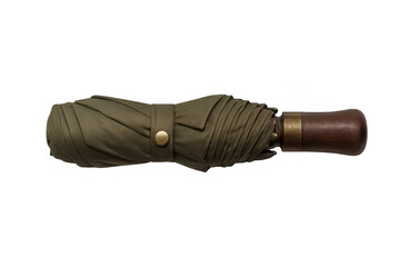 Closed green umbrella with wooden handle on transparent background