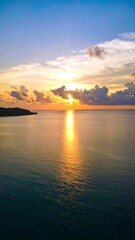 Fototapeta premium Sunset over a calm ocean