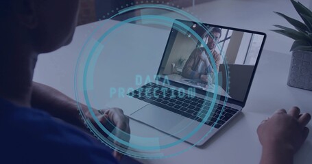 Joining call woman wearing blue shirt using laptop at desk, data protection overlay, copy space