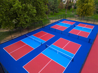 Vibrant drone aerial view of pickleball and tennis courts