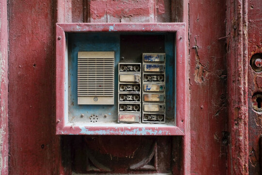 Old Electric Meter Box on a Red Wall
