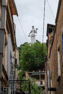 Mother of Georgia Statue Framed by Narrow Alley