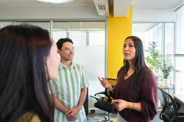 Young Leader Sharing Ideas with Diverse Team