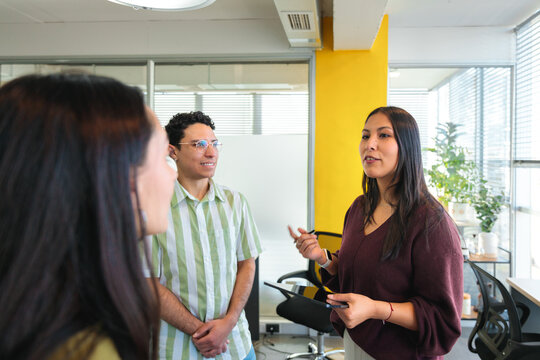Young Leader Sharing Ideas with Diverse Team