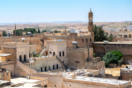 Ancient Cityscape Featuring Stone Architecture and Historic Structures